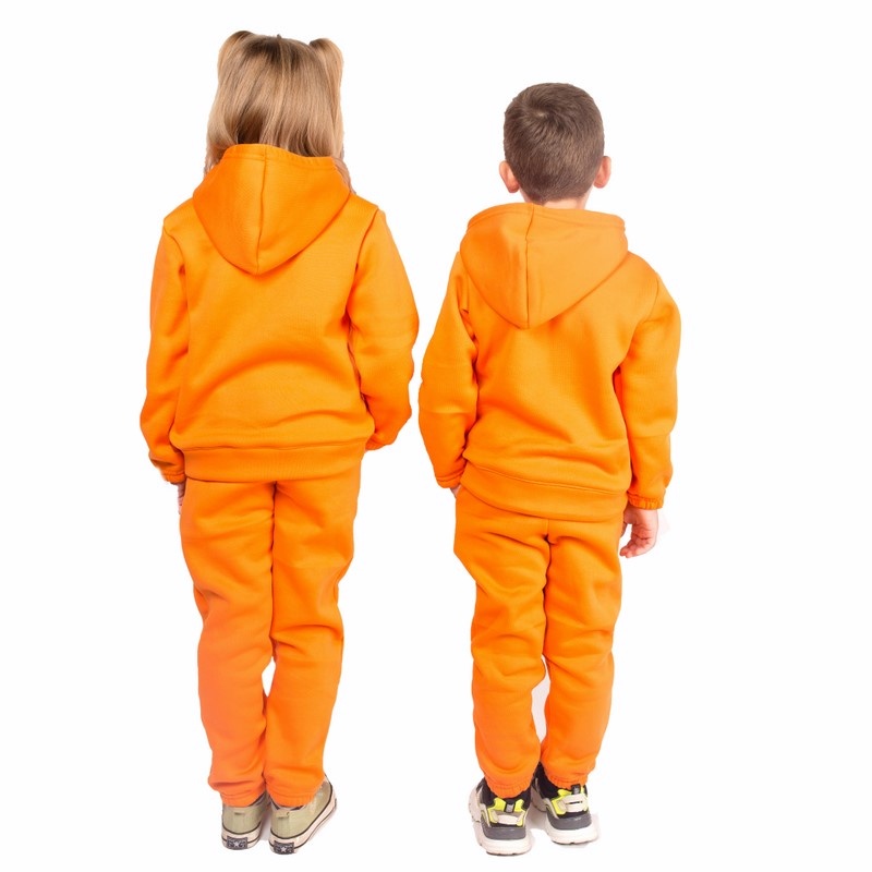 Дитячі трикотажні костюми на дівчинку. Костюм з капюшоном тринитка на флісі помаранчевого кольору. ТМ «Пташка Украина»